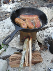 Emberlit cooking rabbit sausage
