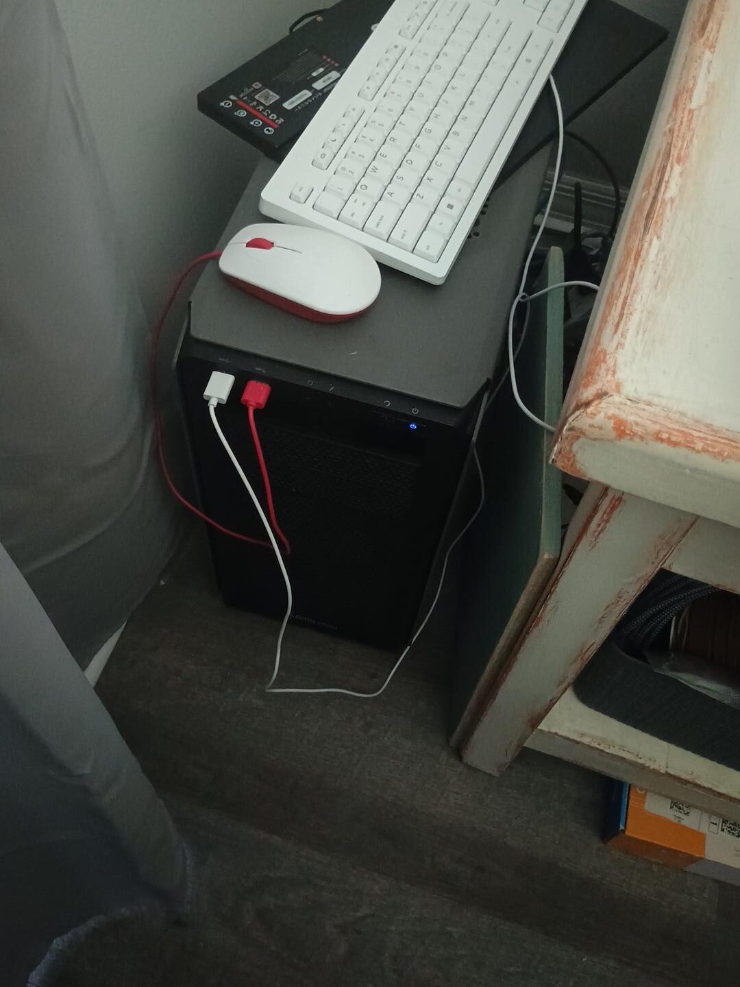 DB's home server, keyboard and mouse in a small home workspace
